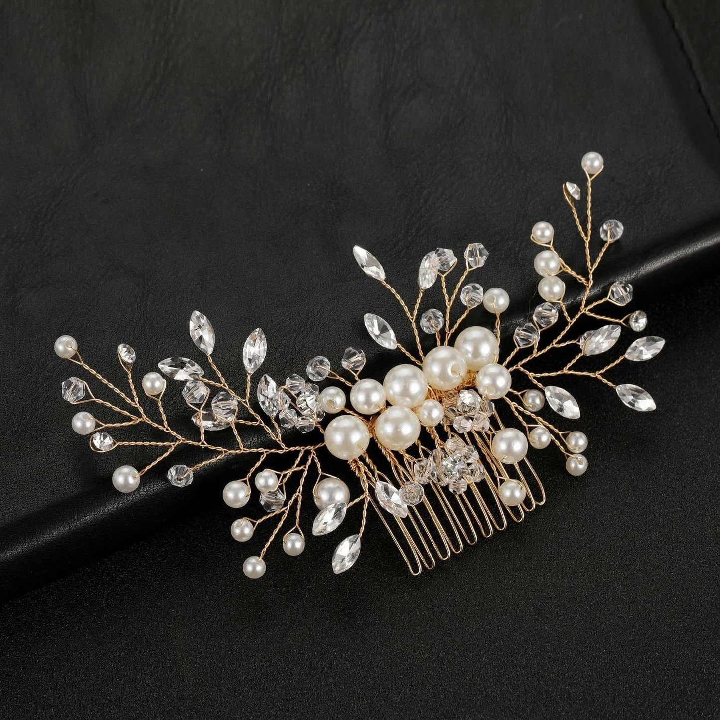Gold-plated rhinestone and pearl bridal hair comb on a black background