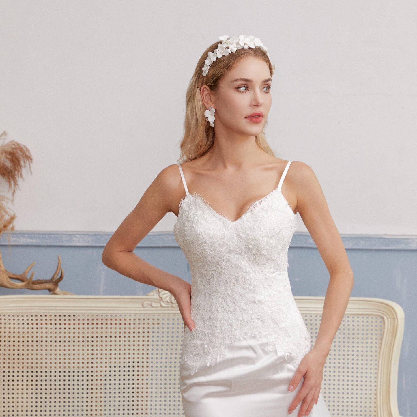 Skillfully handcrafted, these flower bridal earrings are the perfect complement to our signature porcelain headpieces. Each earring is exquisitely made by hand, featuring two delicate white clay flowers adorned with freshwater pearls.