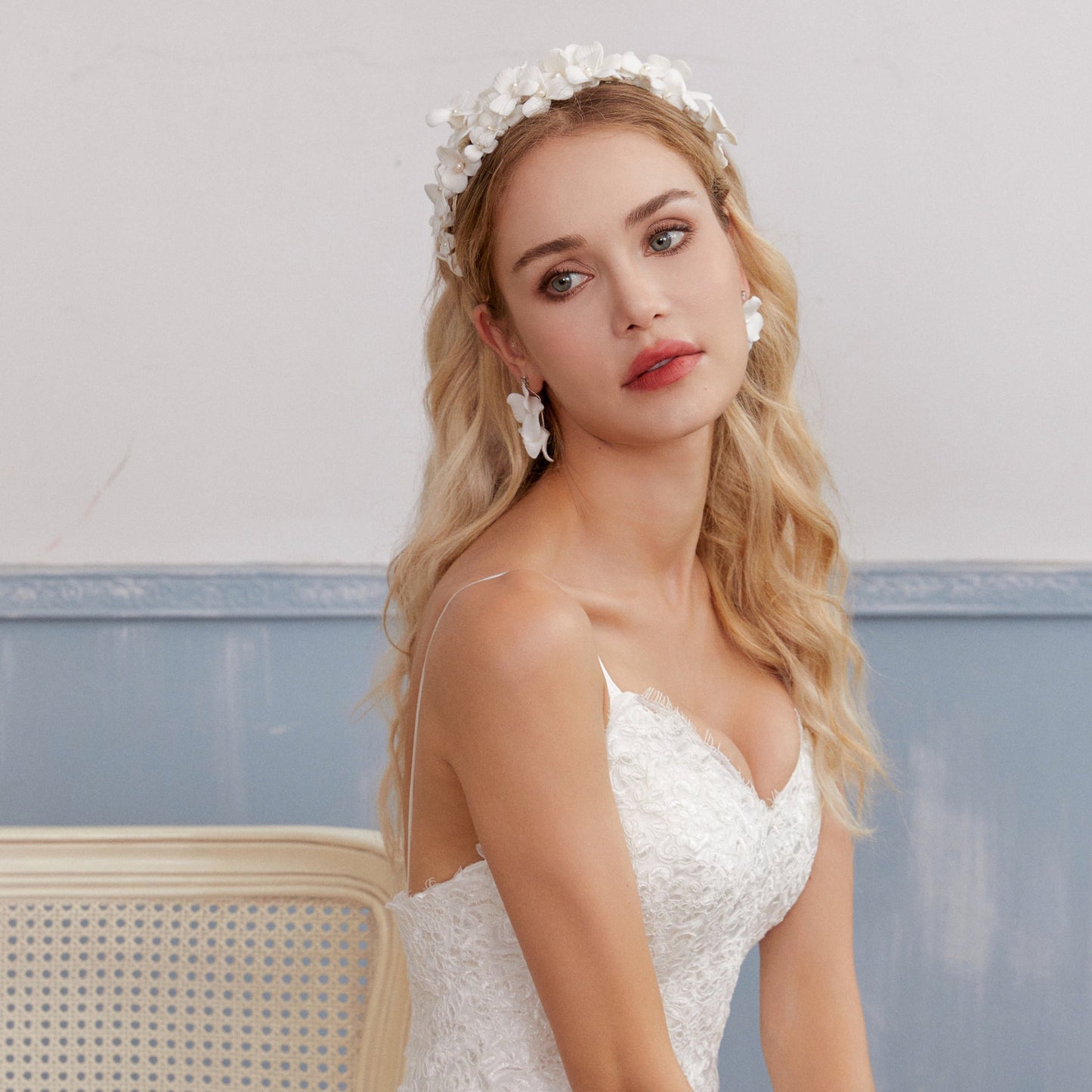 A gloriously romantic hand-sculpted porcelain bridal crown. Made with an arrangement of individually crafted flowers and dainty pearls. This full and textured headband makes a statement but yet still feels incredibly feminine.
