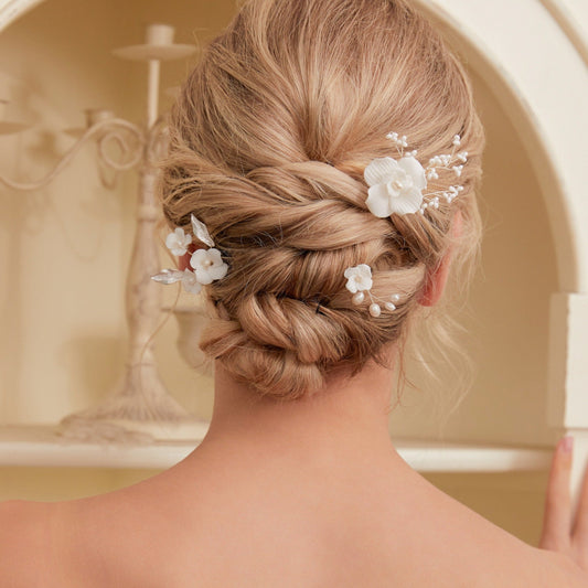 Set of 3 Elegant Pearl and Porcelain Floral Bridal Hairpins. Each hairpin features beautifully hand sculpted porcelain blossoms and dainty freshwater pearls, intricately arranged and hardwired using gold or silver plated wire.