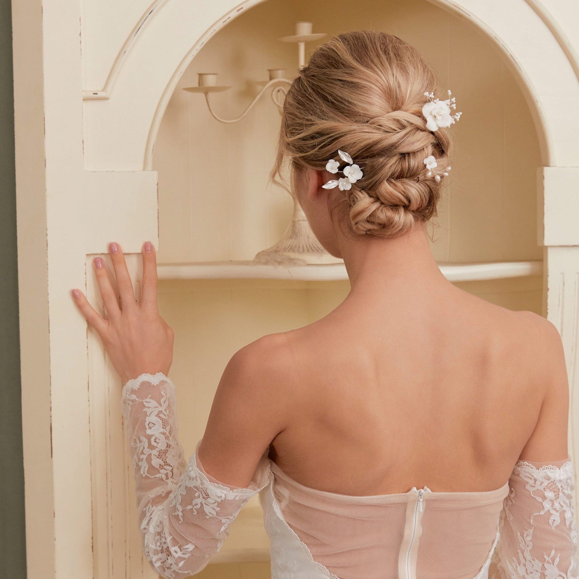 Set of 3 Elegant Pearl and Porcelain Floral Bridal HairpinsEach hairpin features beautifully hand sculpted porcelain blossoms and dainty freshwater pearls, intricately arranged and hardwired using gold or silver plated wire.