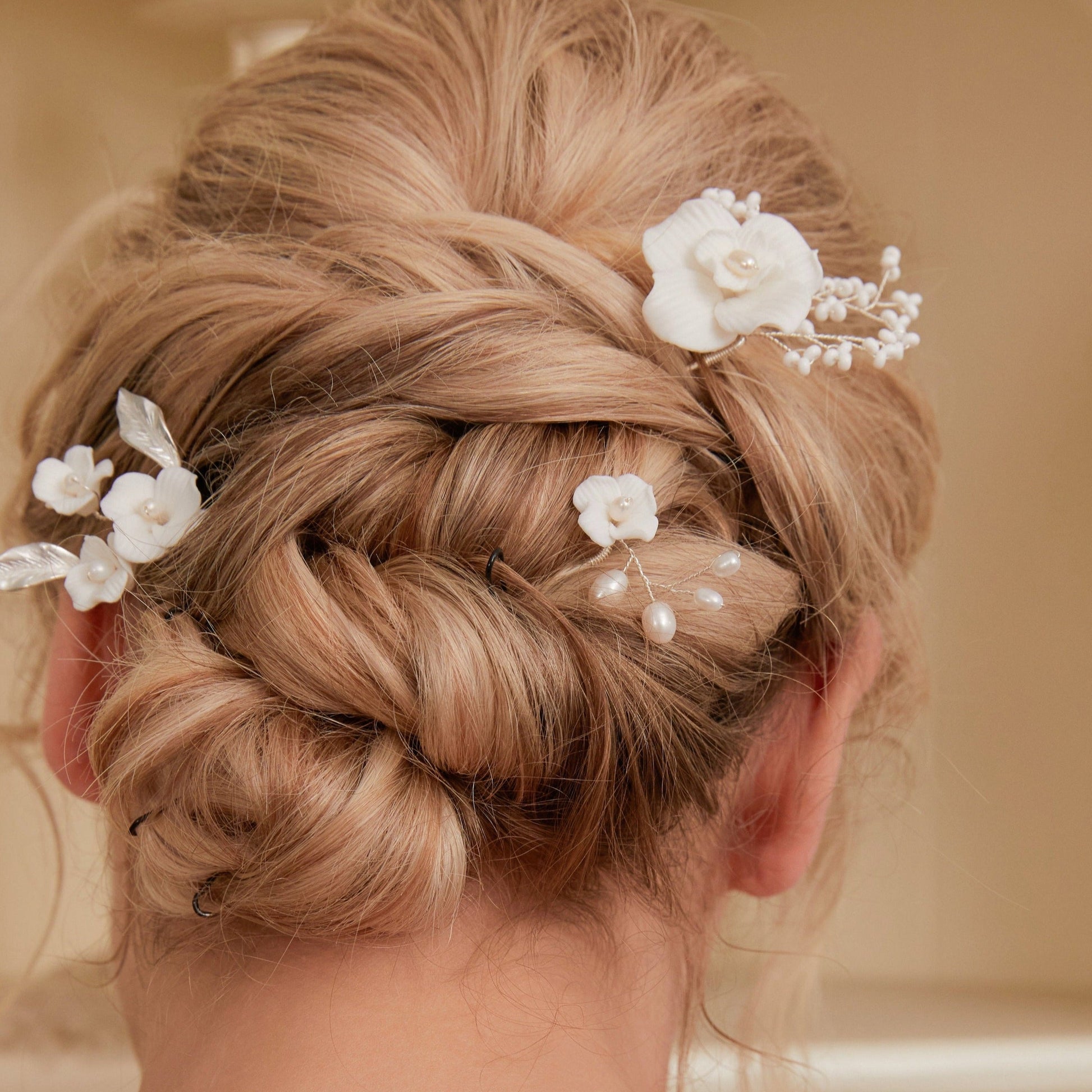 Set of 3 Elegant Pearl and Porcelain Floral Bridal Hairpins. Each hairpin features beautifully hand sculpted porcelain blossoms and dainty freshwater pearls, intricately arranged and hardwired using gold or silver plated wire.