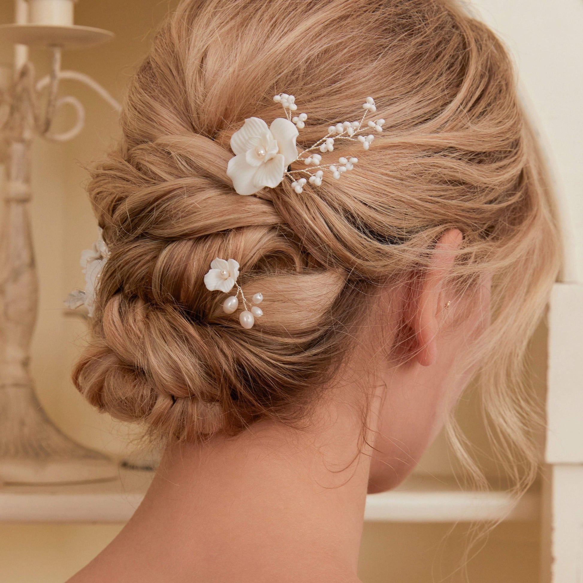 Set of 3 Elegant Pearl and Porcelain Floral Bridal Hairpins. Each hairpin features beautifully hand sculpted porcelain blossoms and dainty freshwater pearls, intricately arranged and hardwired using gold or silver plated wire.