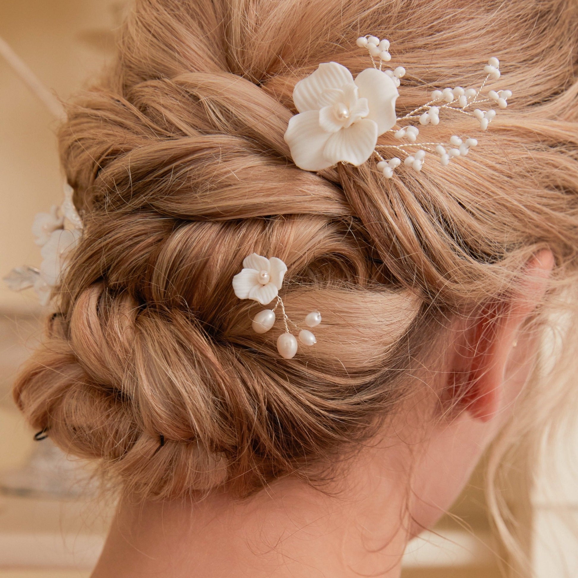 Set of 3 Elegant Pearl and Porcelain Floral Bridal Hairpins. Each hairpin features beautifully hand sculpted porcelain blossoms and dainty freshwater pearls, intricately arranged and hardwired using gold or silver plated wire.