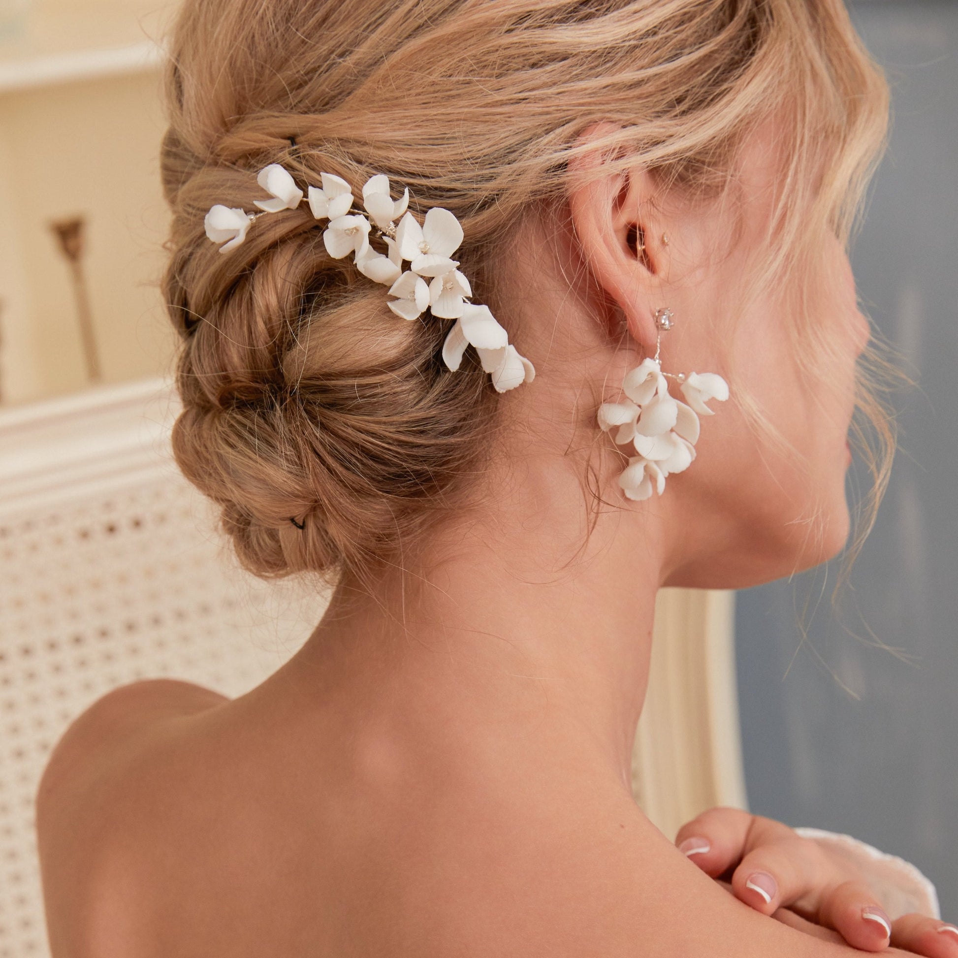 This hair comb is perfect for brides who want a modest and timeless look. It features delicate clay flowers and small beads that are arranged carefully to create a romantic and classic design.