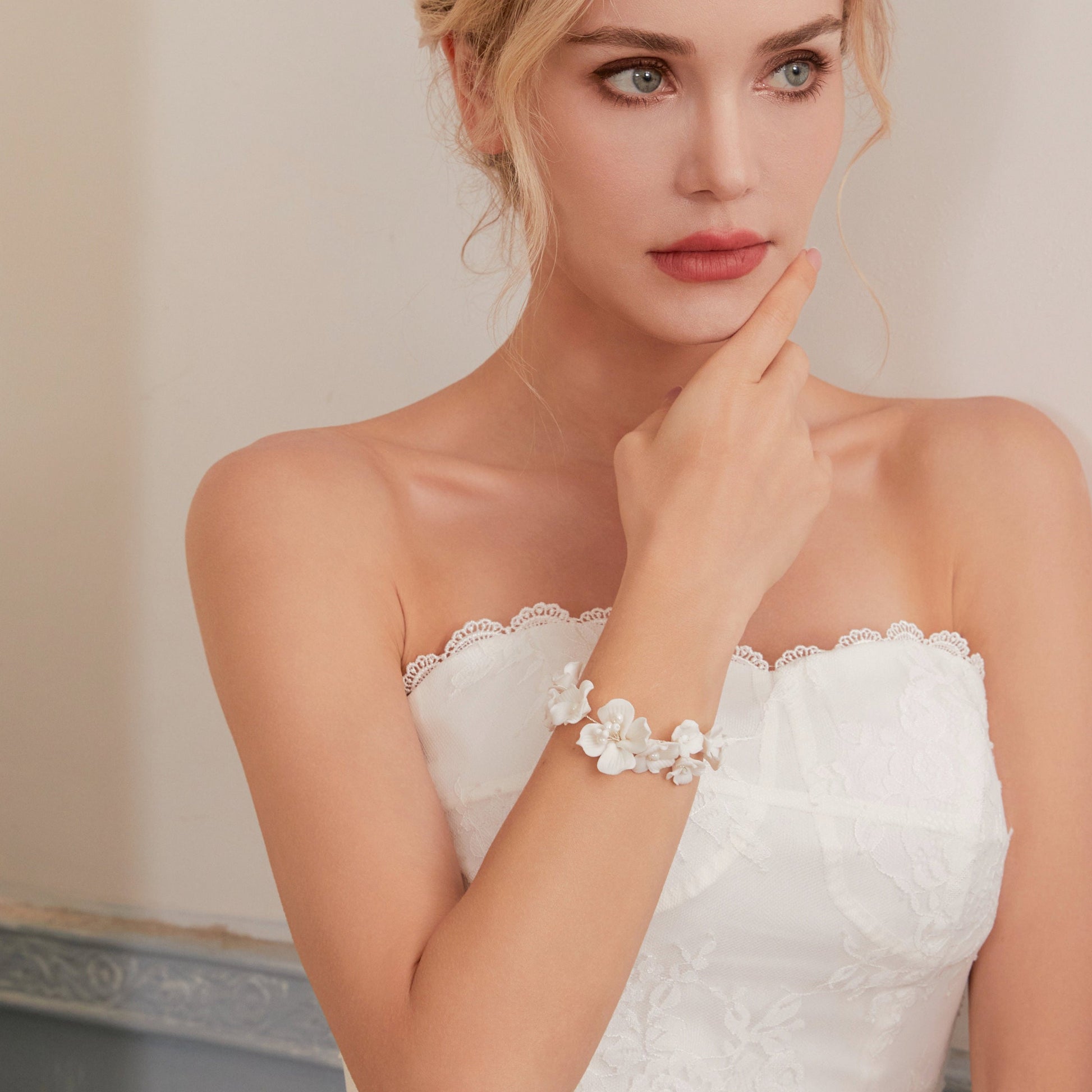 This beautifully crafted porcelain bracelet features individually carved flowers and an impressively full and intricate design.