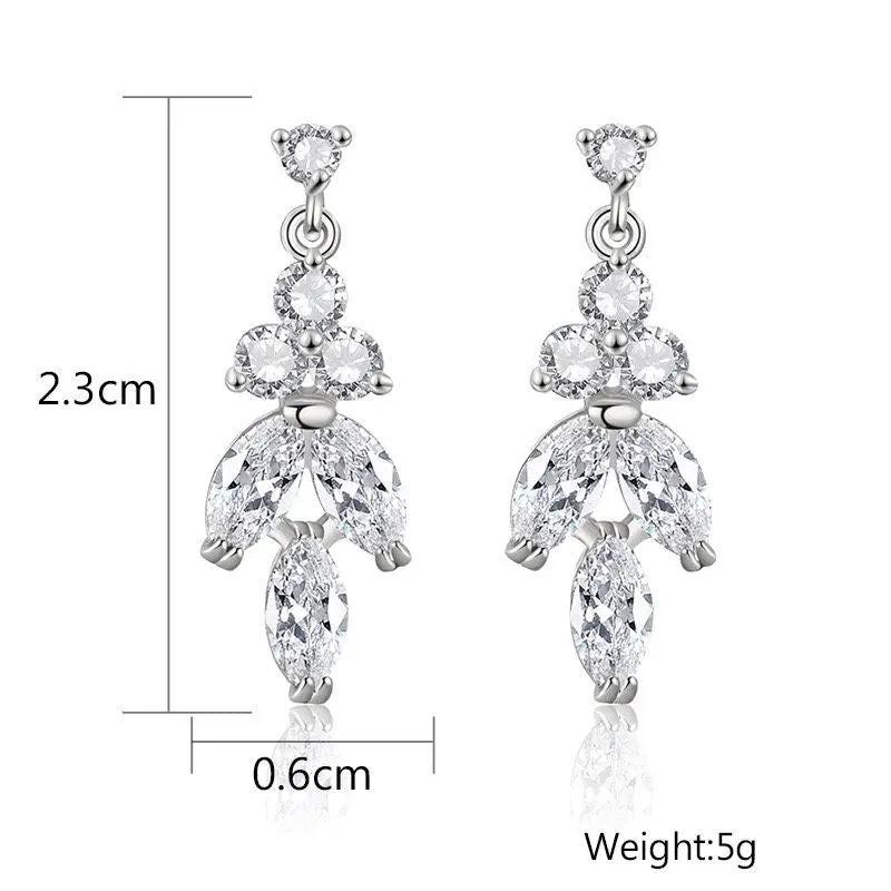 Dimensions of silver leaf drop earrings: 23mm length, 6mm width