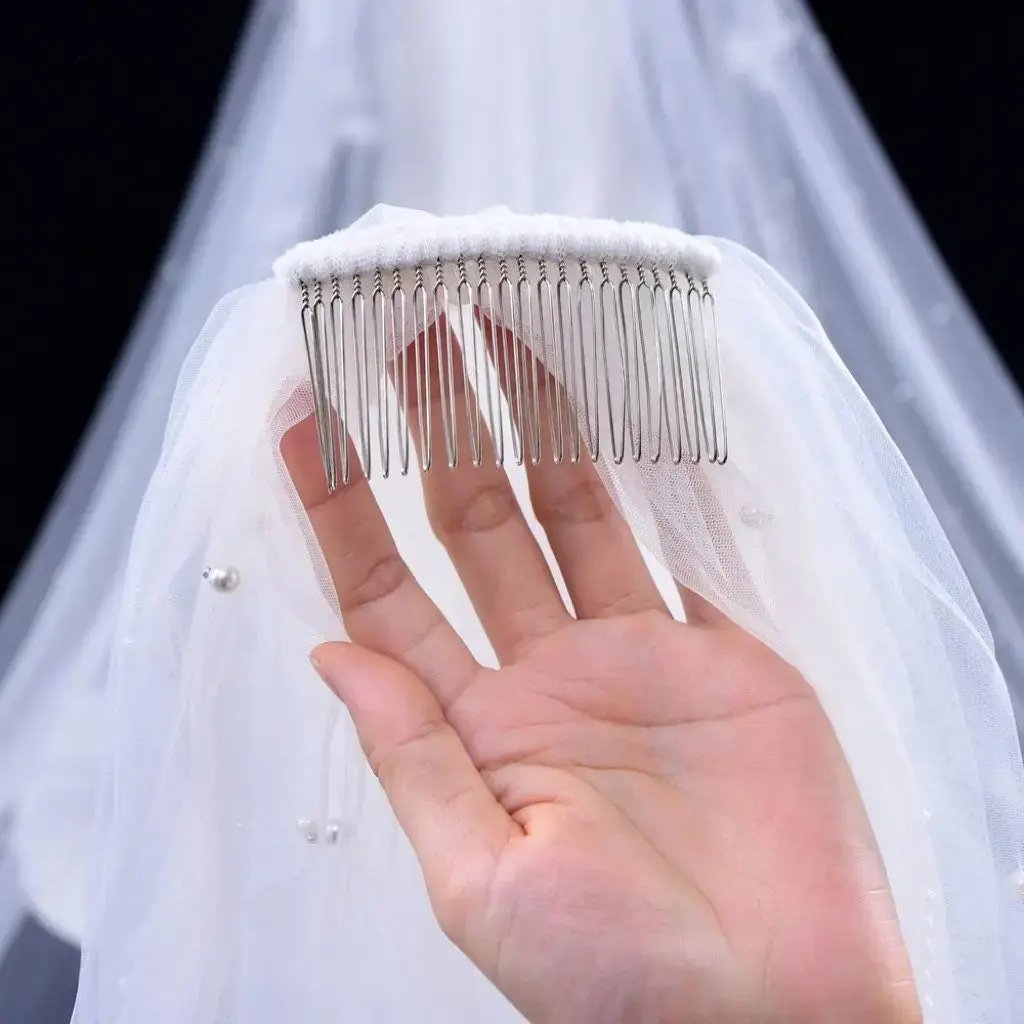 Detail of the secure comb attachment on the pearl bridal veil