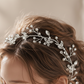 Close-up of pearl and crystal detailing on silver bridal hair vine headpiece