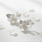 Close-up of silver-plated porcelain blossom and leaf hair pin for weddings