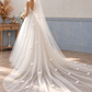 Rear view of a bride wearing a white 3m cathedral wedding veil with scattered three-dimensional flowers