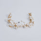 This beautifully hand-sculpted clay & pearl crown features individually crafted cherry blossom flowers, dainty freshwater pearls, and crystals. The result is a full, textured headband that makes a statement while remaining incredibly feminine.
