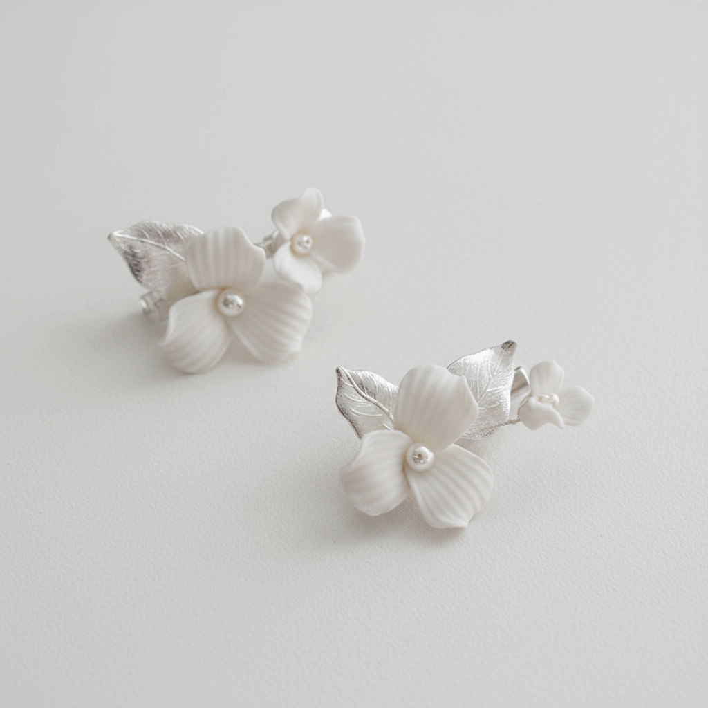 Close-up of silver-plated porcelain blossom and leaf hair pin for weddings