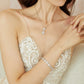 Bride wearing a matching teardrop crystal necklace and bracelet set