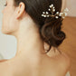 Side view of a bride wearing a pearl branch hair pin