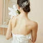 Bride wearing a silver rhinestone hair comb in an elegant updo