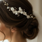 Bride wearing white porcelain flower bridal hair comb with freshwater pearls in elegant updo