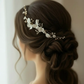 Bridal side profile with white porcelain flower pearl comb in low bun hairstyle