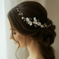 Bridal side profile with white porcelain flower pearl comb in low bun hairstyle
