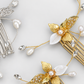 Gold and silver comb detail showing textured metallic leaves, white leaf accents, pearls and CZ branches