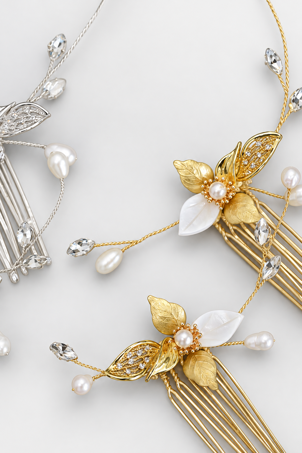 Gold and silver comb detail showing textured metallic leaves, white leaf accents, pearls and CZ branches