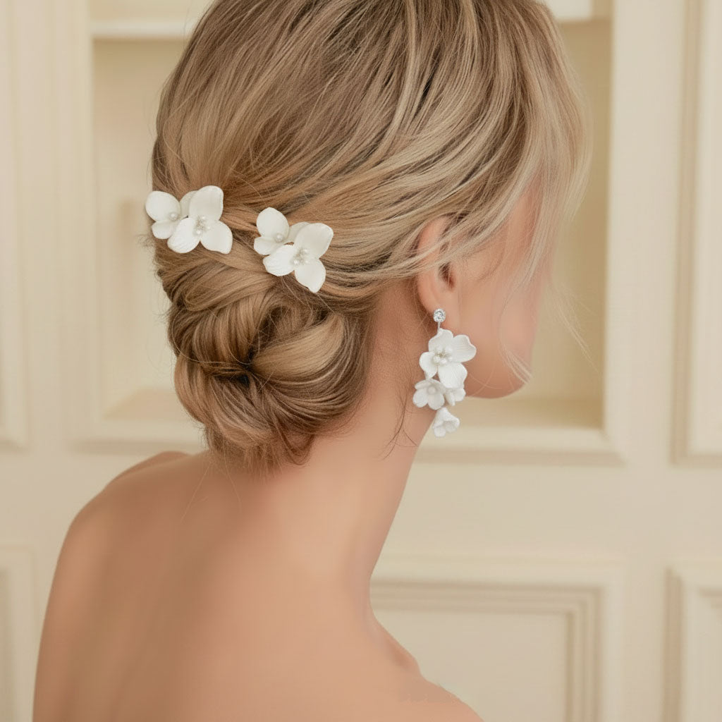 Bride wearing ceramic flower hair comb and earrings wedding day