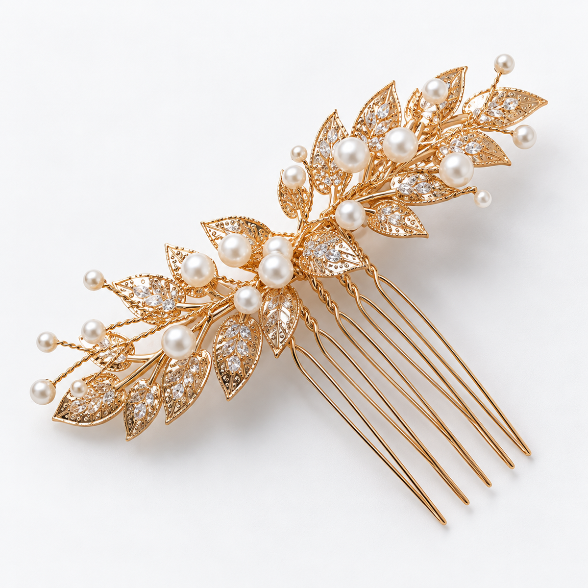 Angled view of the openwork gold leaf bridal hair comb showing clear cubic zirconia stones, white bead accents and comb teeth