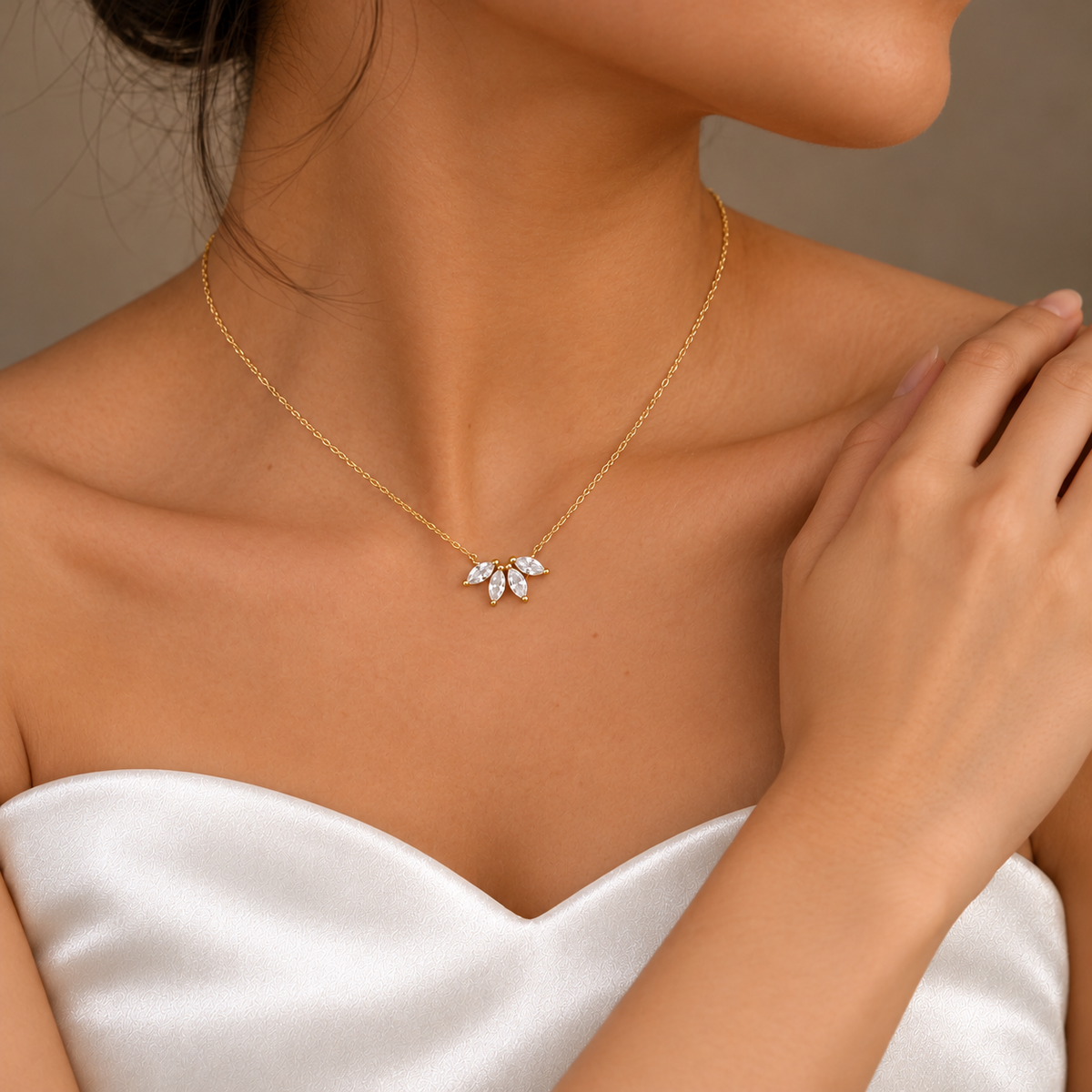 Three-quarter view of a bride wearing a marquise flower petal necklace