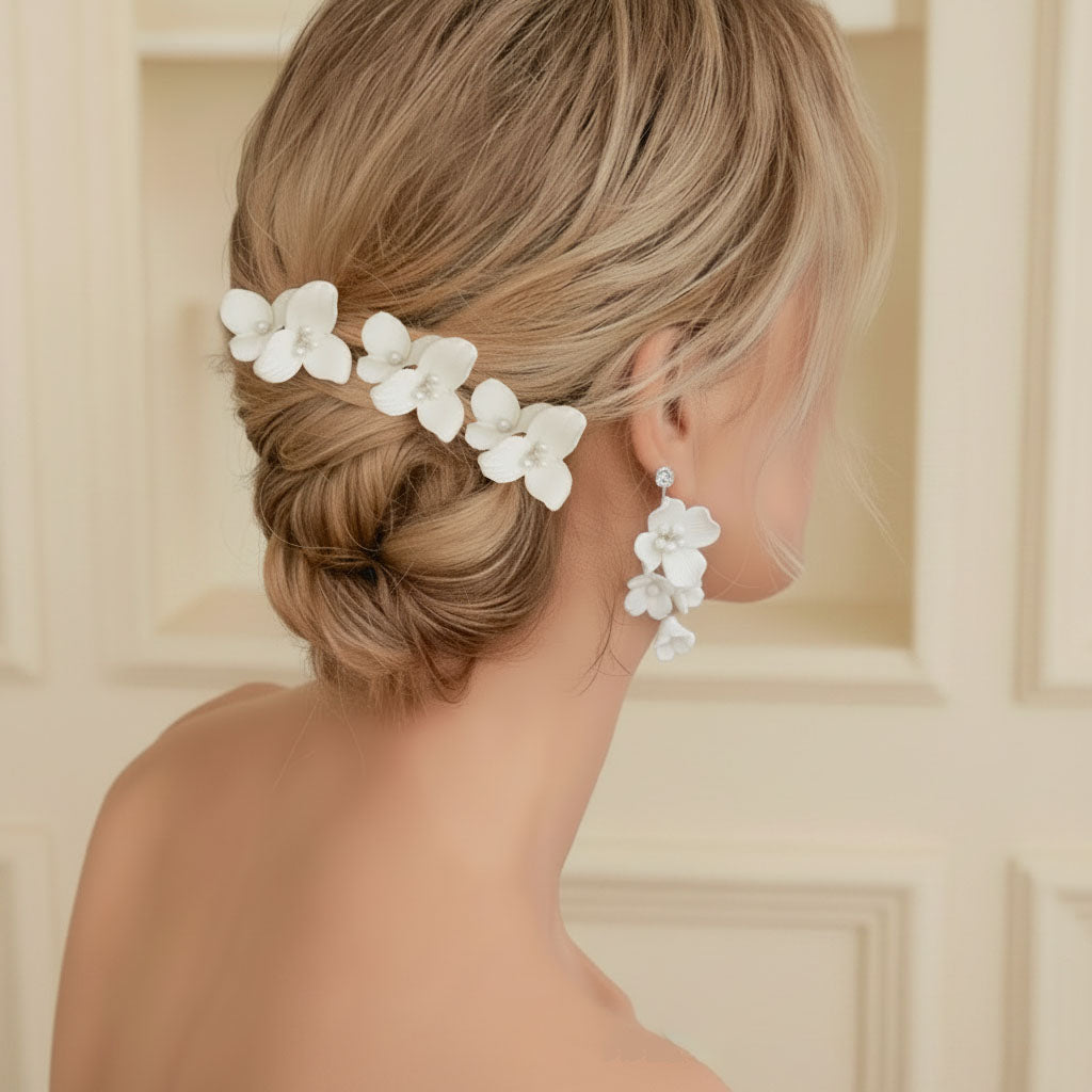 Bride wearing ceramic flower hair comb and earrings wedding day