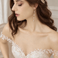 Bride wearing the gold leaf and CZ hair comb with long pearl chain earrings; choose the set option to receive both