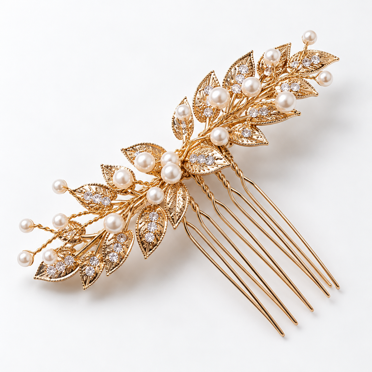Diagonal product view of the gold leaf bridal comb with branching white bead details
