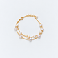 Freshwater pearl bracelet with two gold chains and a pearl-tipped extension chain
