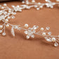 Close-up of pearl and crystal detailing on silver bridal hair vine headpiece
