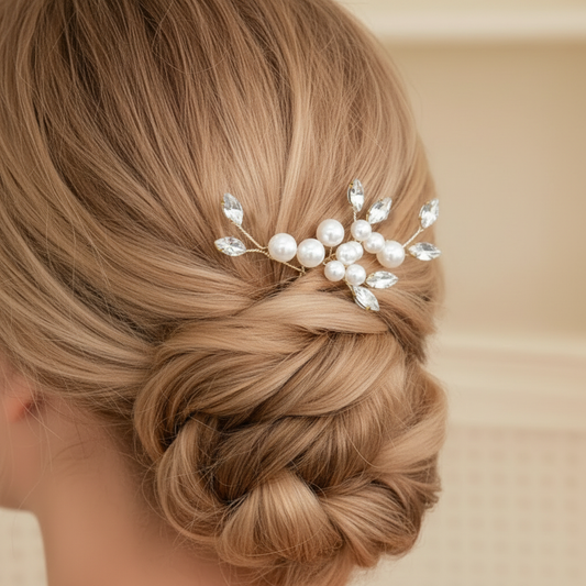 Back view of a bride's hairstyle featuring gold pearl and crystal hair pins