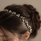 Close-up detail of freshwater pearls and twisted gold-plated wire on handmade bridal crown, showing intricate hand-wrapped craftsmanship
