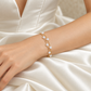 Side view of a double-strand pearl bracelet worn on the wrist