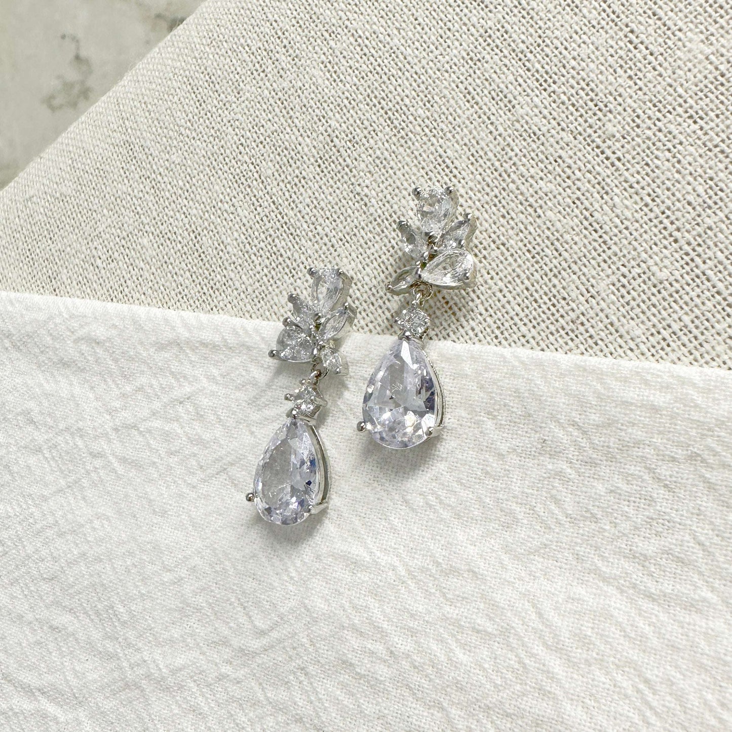 Side view of EVIE dainty crystal drop earrings showing the delicate setting
