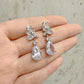 EVIE lightweight crystal bridal earrings held in hand to show scale
