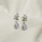 EVIE floral-inspired silver wedding earrings on a white background
