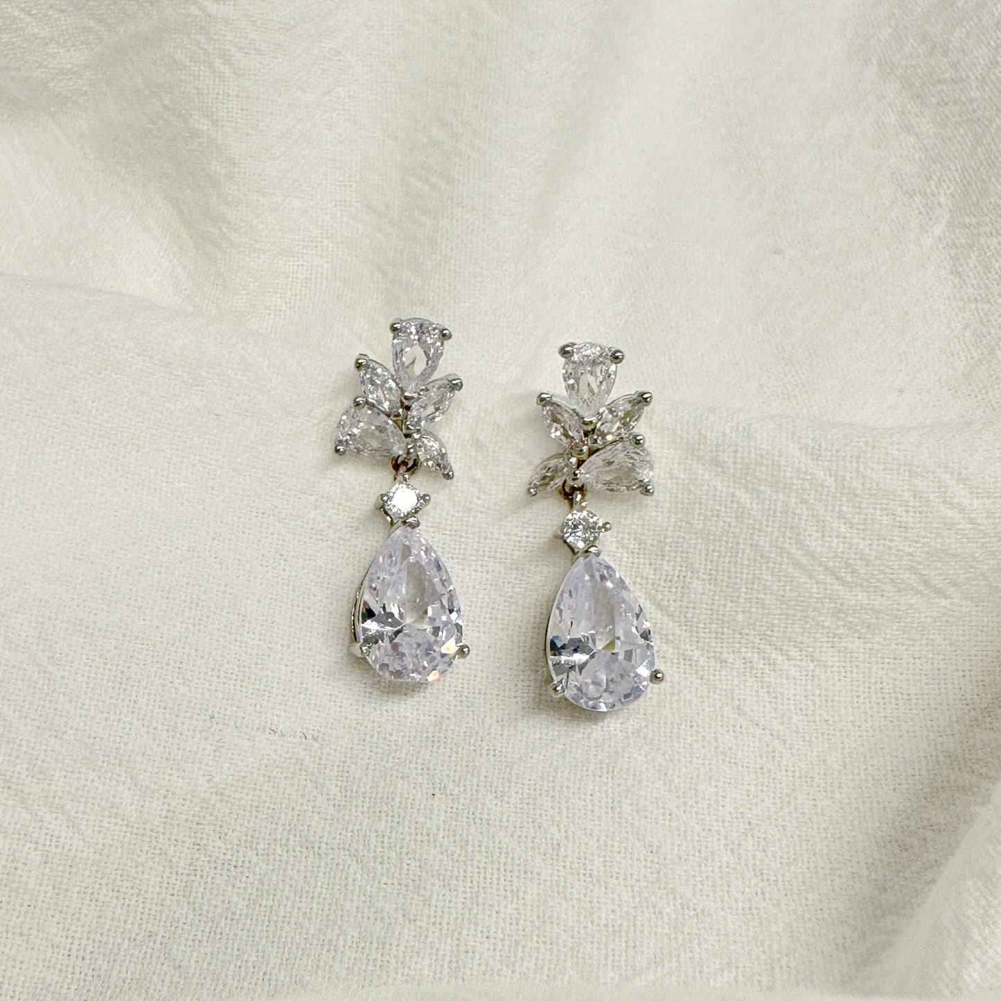 EVIE floral-inspired silver wedding earrings on a white background