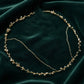 Full flat lay view of handmade pearl and gold wire wedding crown, showing adjustable wire construction and ivory pearl placement