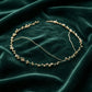Full flat lay view of handmade pearl and gold wire wedding crown, showing adjustable wire construction and ivory pearl placement