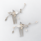 Pair of silver-plated pearl and CZ leaf bridal hair combs on a pale grey background