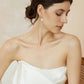 Bride wearing pearl drop earrings - delicate wedding jewelry on model