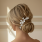 Model wearing the LILLIAN gold porcelain flower hairpin in a low bun