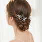 Side view of a bride wearing a delicate pearl hair pin