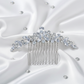 Front view of the sparkling rhinestone leaf hair comb on a blue surface