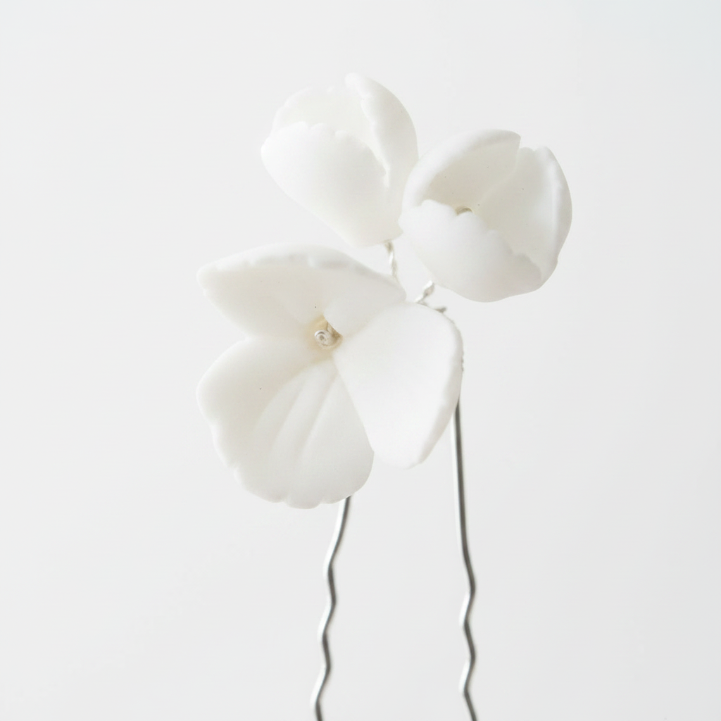White ceramic flower hair pins flat lay — handcrafted porcelain bridal hair accessories by PearlandStone