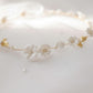 Handmade ceramic flower and imitation pearl details on gold bridal hair vine and bracelet set