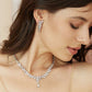 Side profile of a model wearing the NORA petal CZ crystal drop earrings